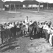 Child migration - British youth migrants learning how to mount and ride a horse at the Salvation Army Training Farm for Boys, Riverview, Queensland.